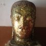 Une tête de Buddha dorée au Wat Phra Ram